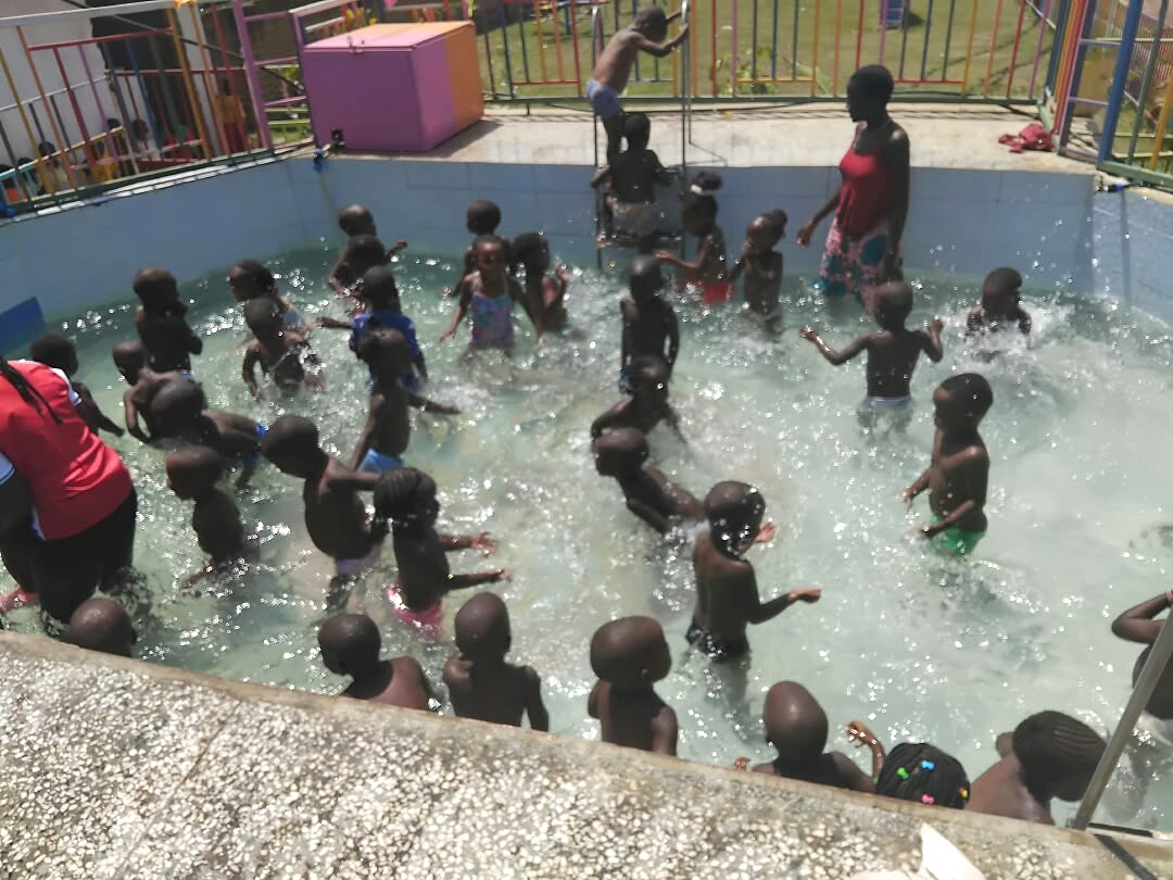 A group of learners enjoy time in a pool.